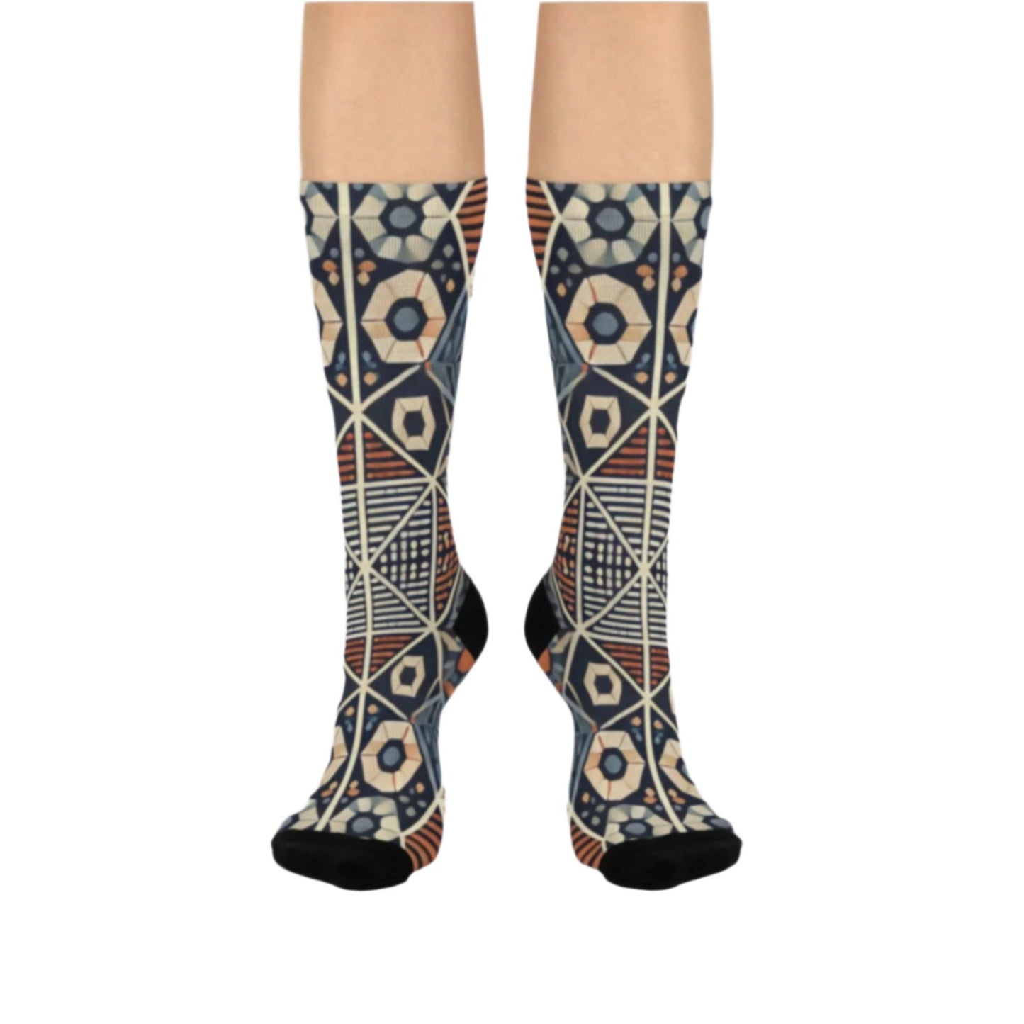 Geometric patterned crew socks with intricate shapes in earthy tones, featuring black accents on the toe and heel.