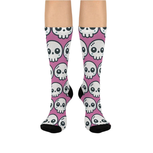 Pink socks featuring a kawaii skull. The toe and heel sections are solid black, adding contrast to the monochromatic design. Perfect for fans of bold, statement accessories.