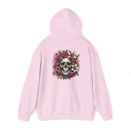 Pinkk hoodie with a skull surrounded by lilies and roses on the back from The Killer Tee. 