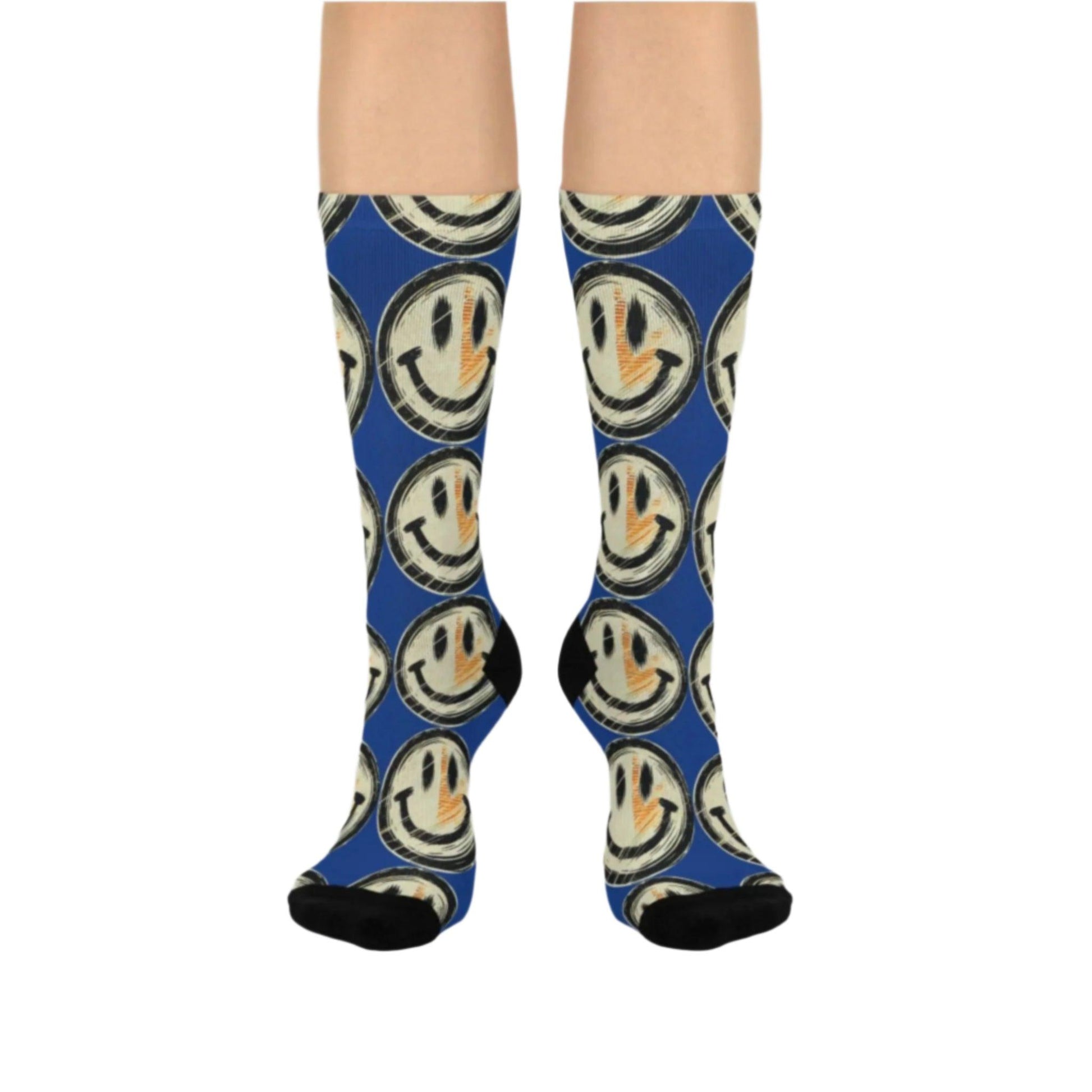 Blue socks featuring a grunge smiley face. The toe and heel sections are solid black, adding contrast to the monochromatic design. Perfect for fans of bold, statement accessories.